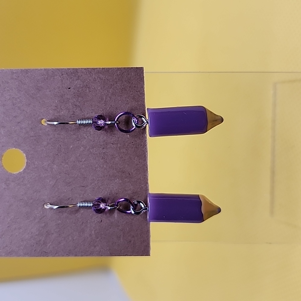 Purple colored pencil earrings